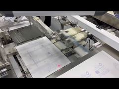 二つ折り機能を備えた手術用手袋財布型包装機